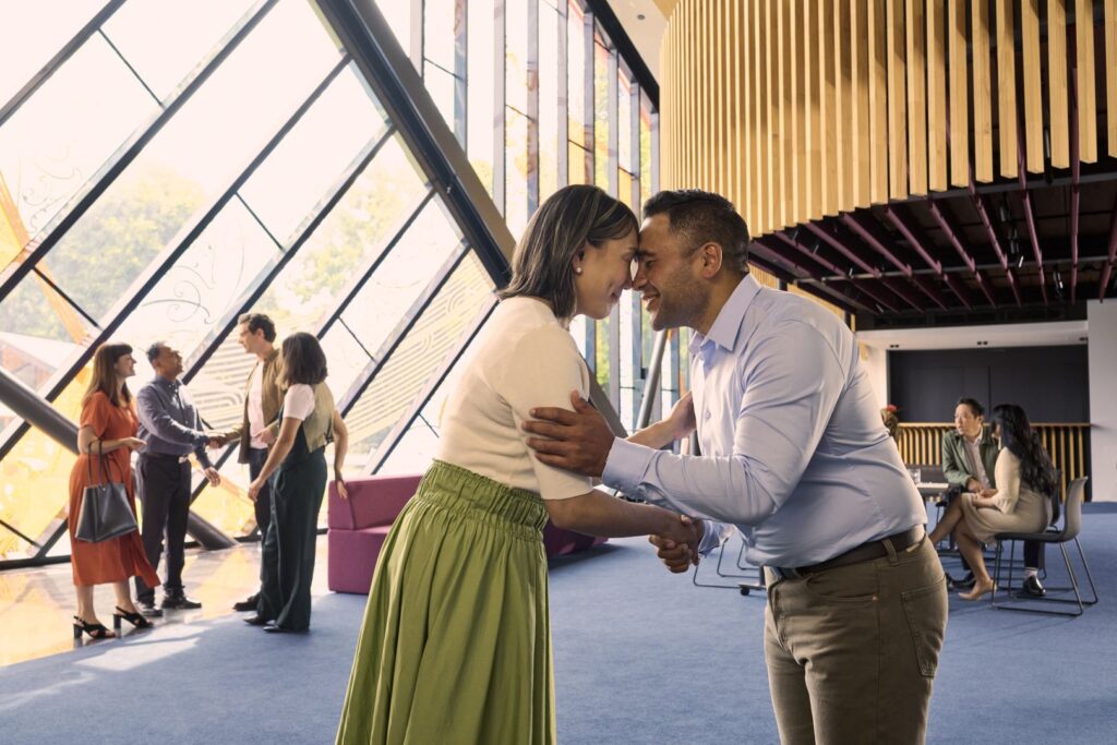 Business people sharing a hongi